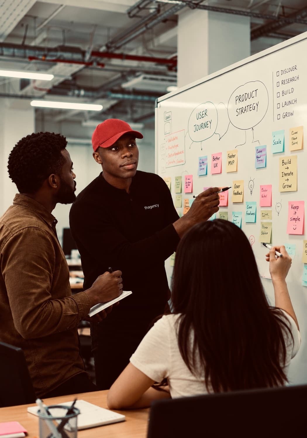 Team members reviewing print samples over coffee
